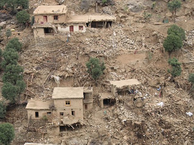 Houses on a mountainside have been destroyed