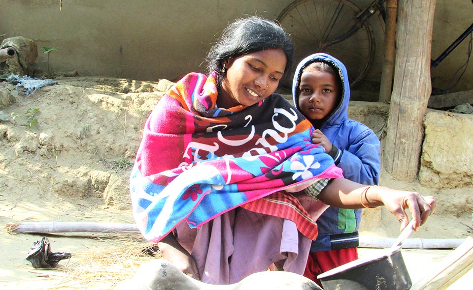 Sunita Hasda, a single mother of three, barely escaped her sinking house during the flooding.