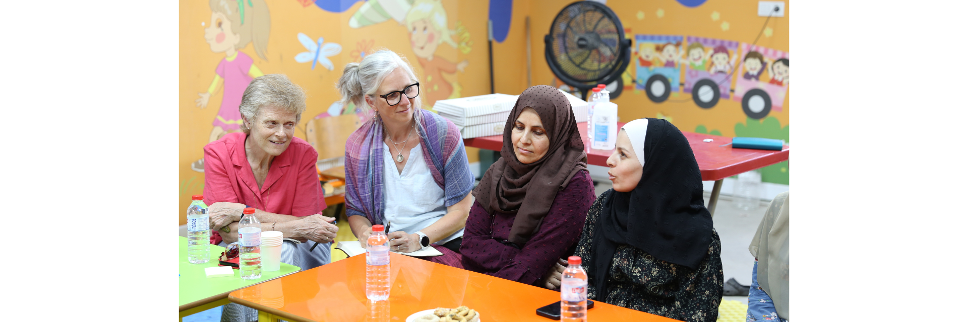 A focus group discussion with Syrian women who live in a refugee camp in Hatay Province, southern Türkiye,  who were sharing their experience of the earthquakes and its impact with Bren Melles, Humanitarian Program  Specialist, Humanitarian Coalition (second from left), and President and CEO, CARE Canada (far left).