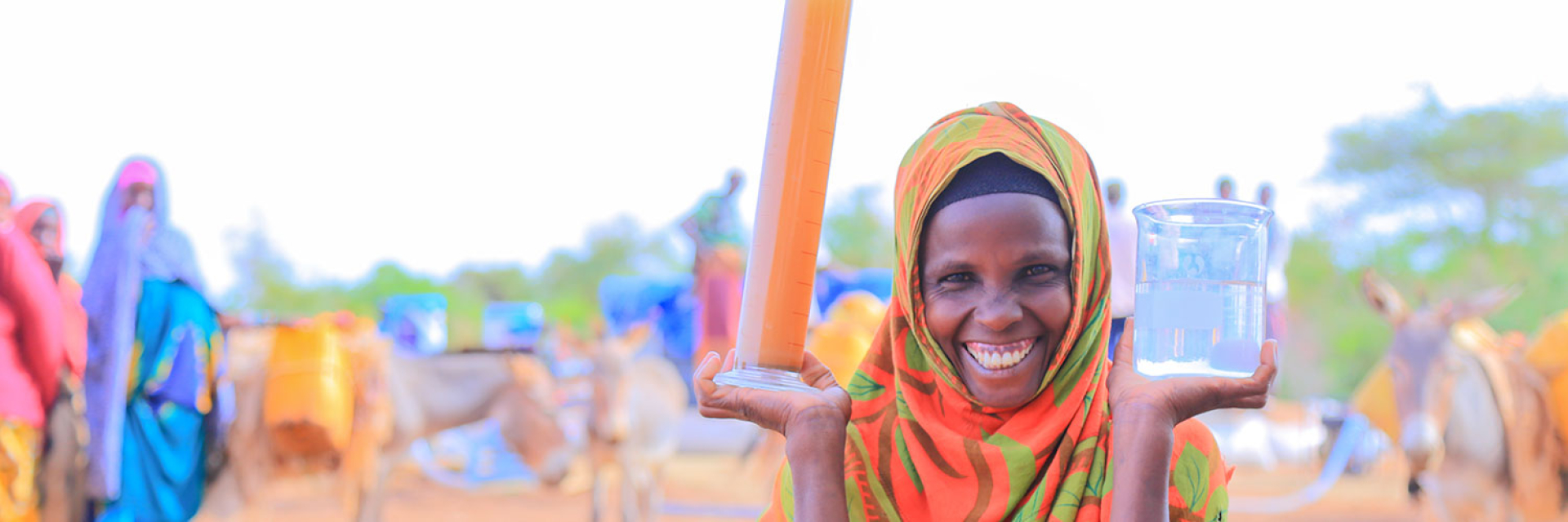 woman in Ethiopia holding clean filtered water