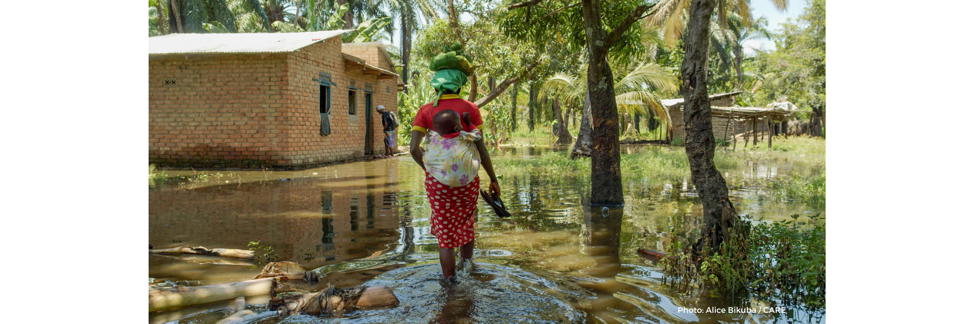 Woman walking through the floods