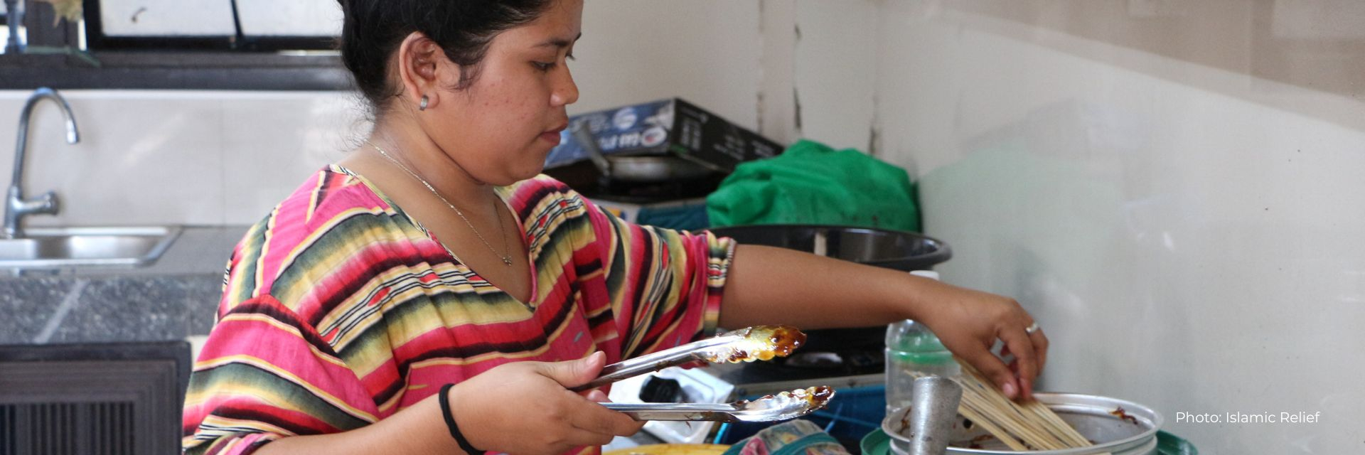 Young woman prepares food