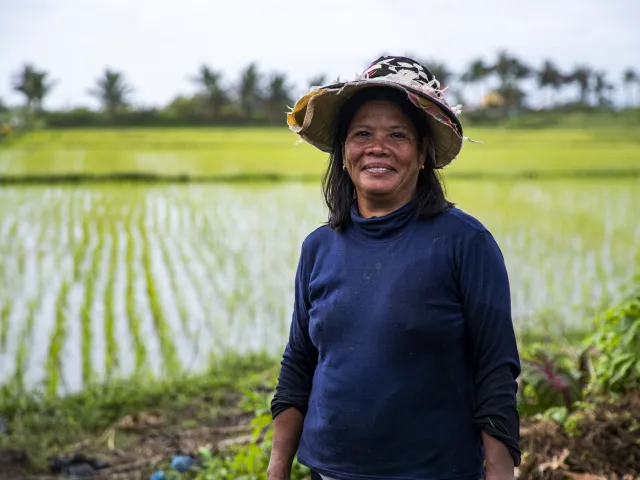 Tita Villon in her rice field following Typhoon Doksuri