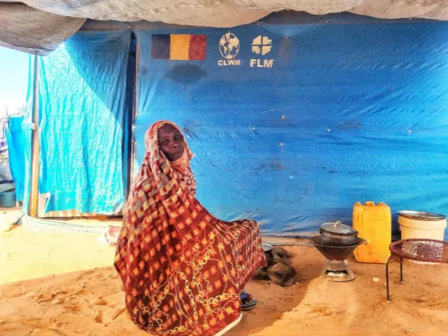 Alia in front of her shelter