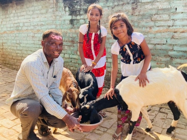 Arun and his two daughters with their new goats